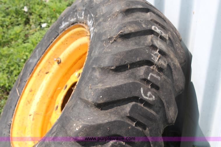 image for item AU9037 10-16.5 skid steer tire and wheel