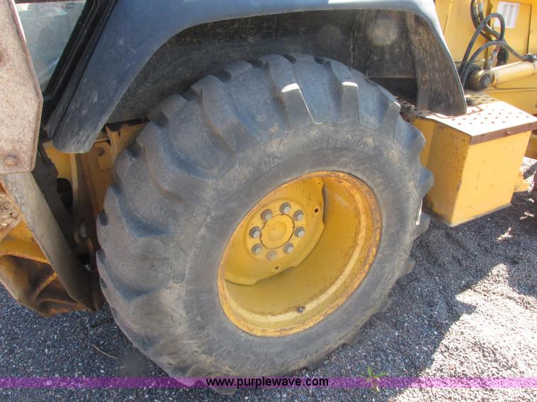 image for item E7307 1999 John Deere 310E backhoe