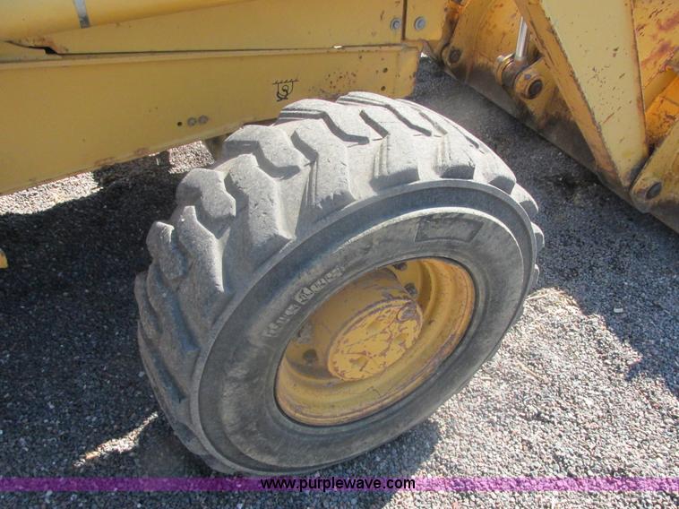 image for item E7307 1999 John Deere 310E backhoe