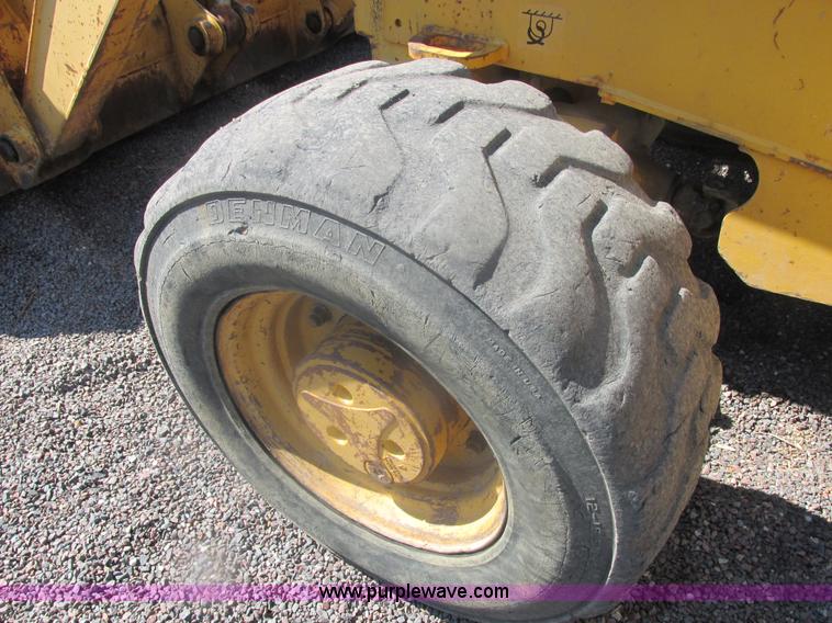 image for item E7307 1999 John Deere 310E backhoe