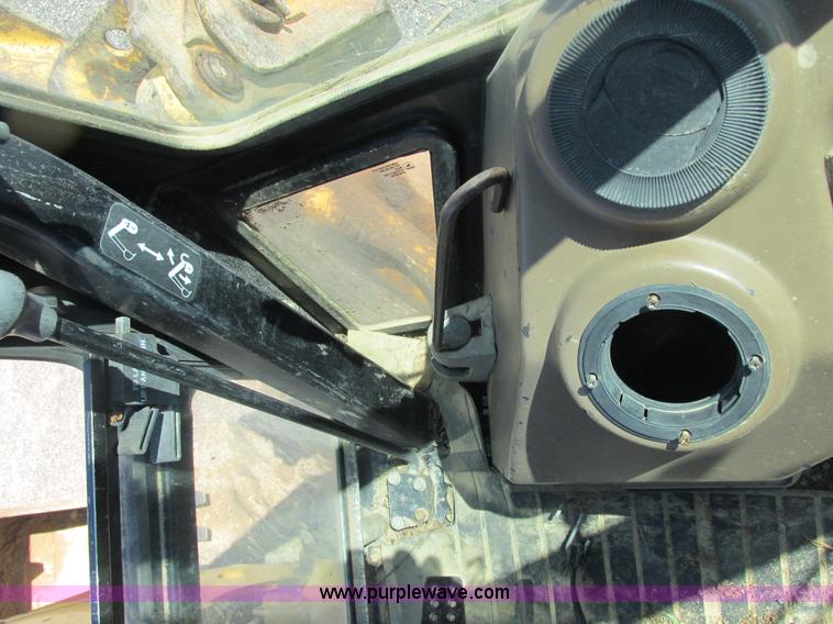 image for item E7307 1999 John Deere 310E backhoe