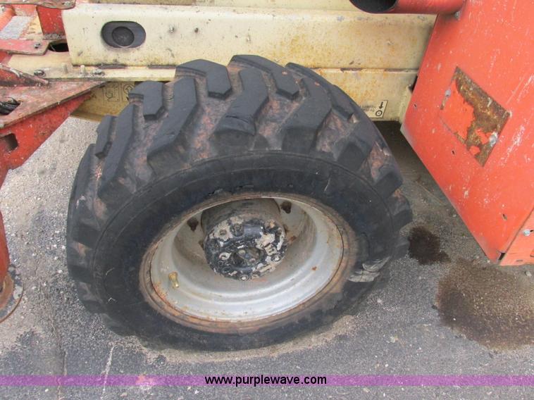 image for item F5189 2002 JLG 500RTS rough terrain scissor lift