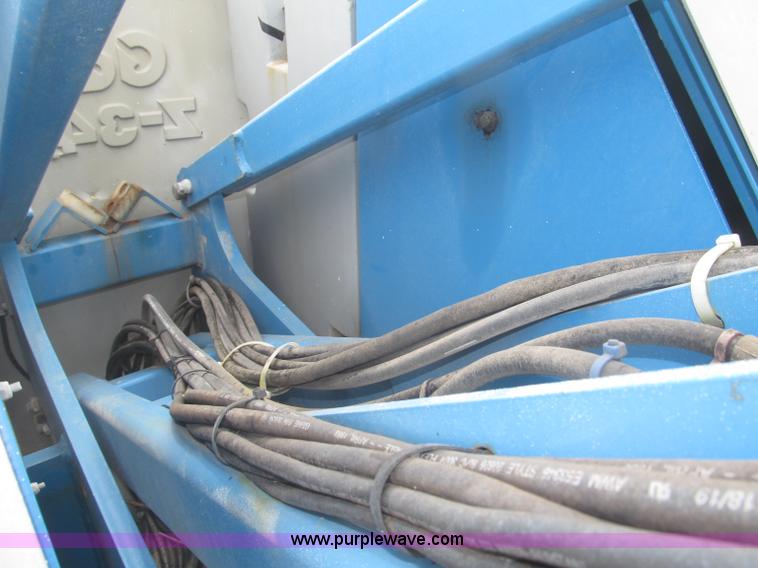 image for item F7076 1999 Genie Z34/22N narrow electric boom lift