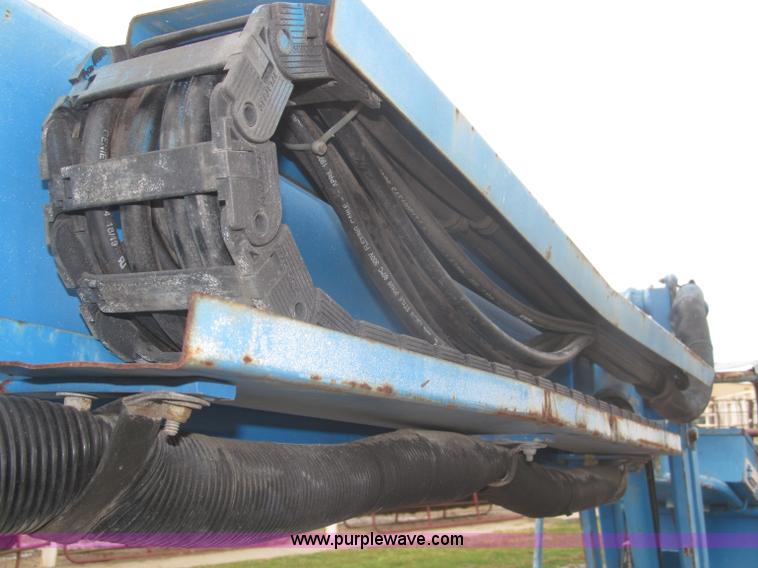 image for item F7076 1999 Genie Z34/22N narrow electric boom lift