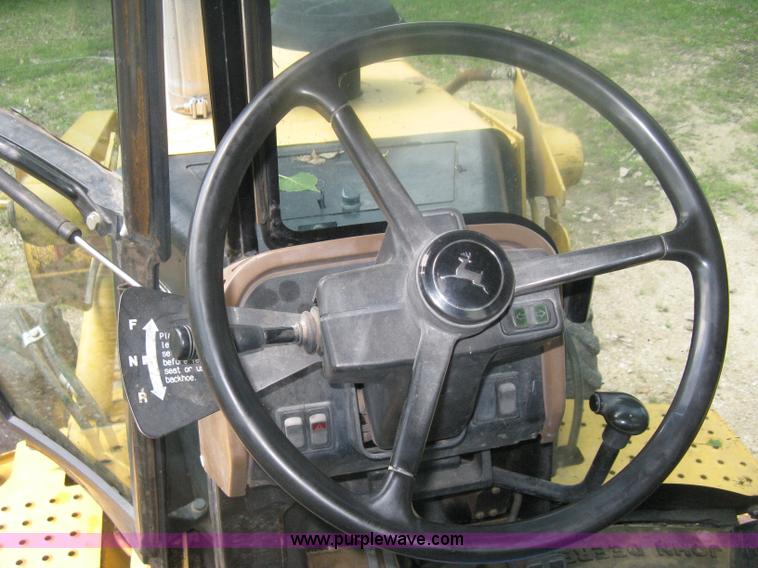 image for item H6466 1999 John Deere 310E backhoe