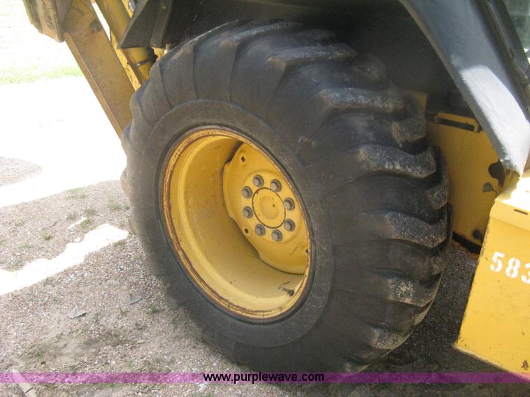 image for item H6466 1999 John Deere 310E backhoe