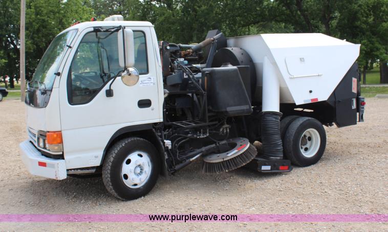 image for item H6736 1999 Isuzu NPR sweeper truck
