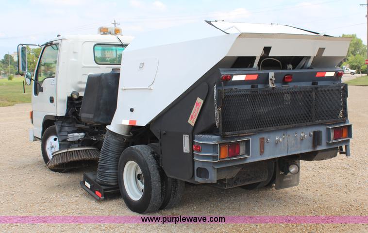 image for item H6736 1999 Isuzu NPR sweeper truck