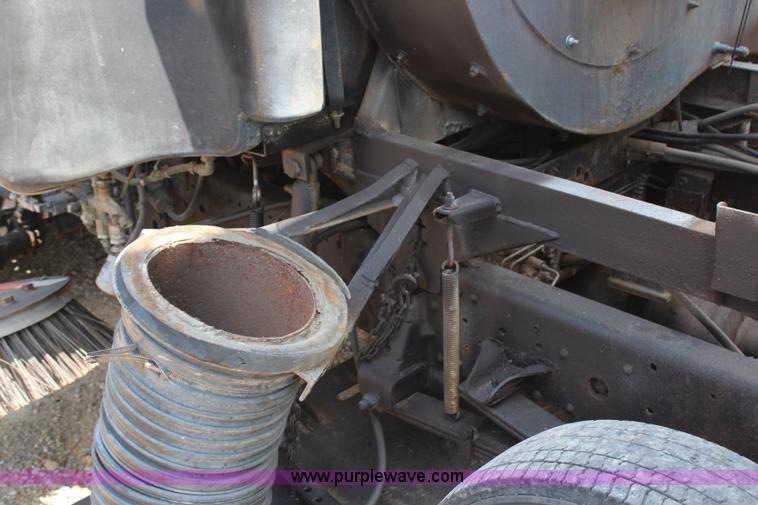 image for item H6736 1999 Isuzu NPR sweeper truck