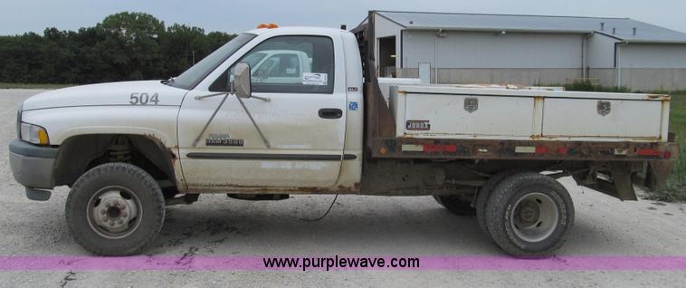 image for item G2070 1998 Dodge Ram 3500 Laramie SLT flatbed pickup truck