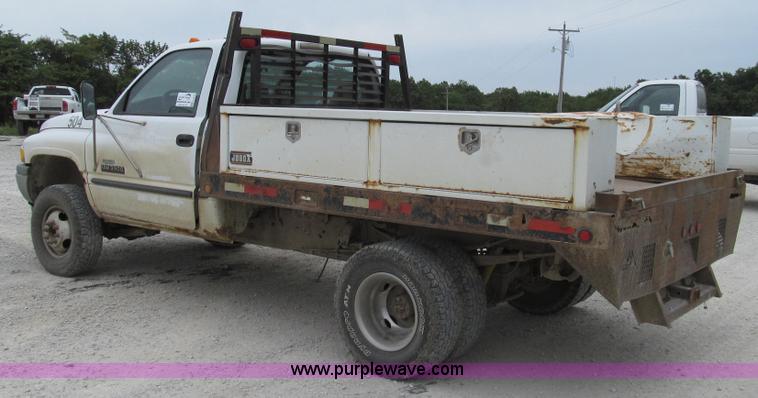 image for item G2070 1998 Dodge Ram 3500 Laramie SLT flatbed pickup truck