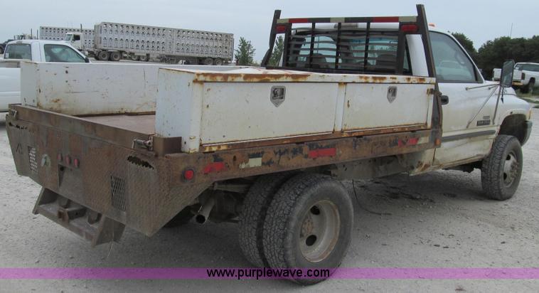 image for item G2070 1998 Dodge Ram 3500 Laramie SLT flatbed pickup truck