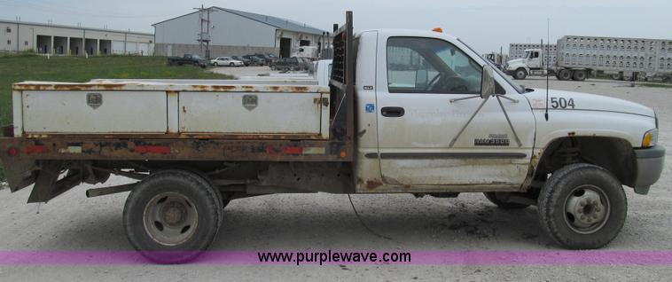 image for item G2070 1998 Dodge Ram 3500 Laramie SLT flatbed pickup truck