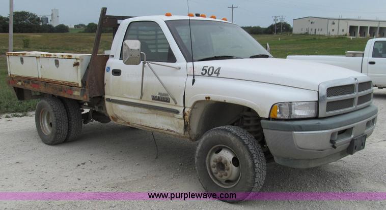 image for item G2070 1998 Dodge Ram 3500 Laramie SLT flatbed pickup truck