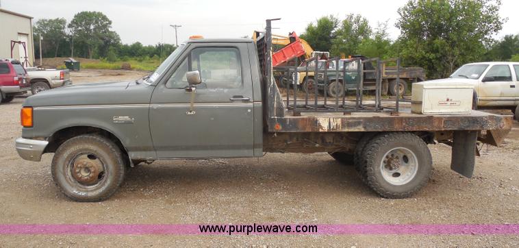 image for item H9854 1990 Ford F350 flatbed pickup truck