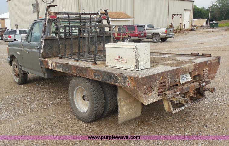 image for item H9854 1990 Ford F350 flatbed pickup truck
