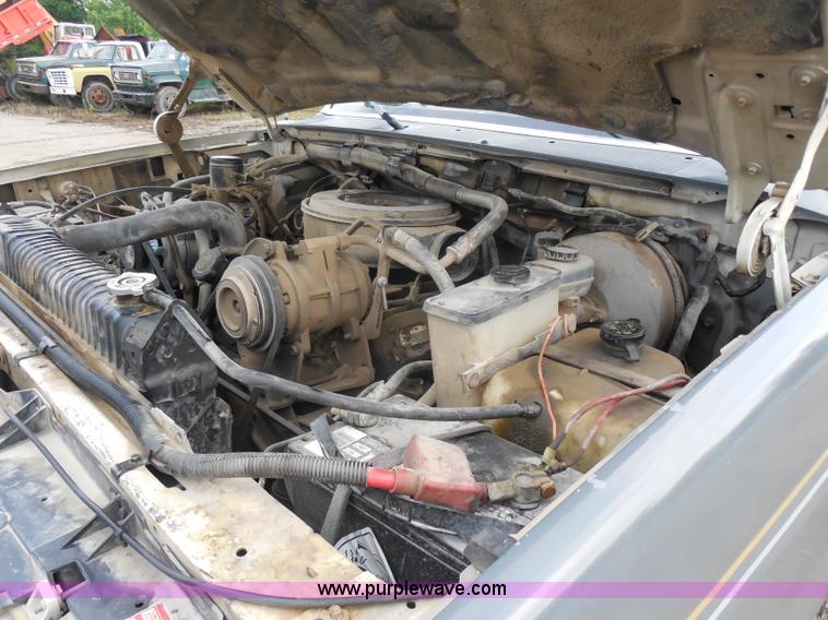 image for item H9854 1990 Ford F350 flatbed pickup truck