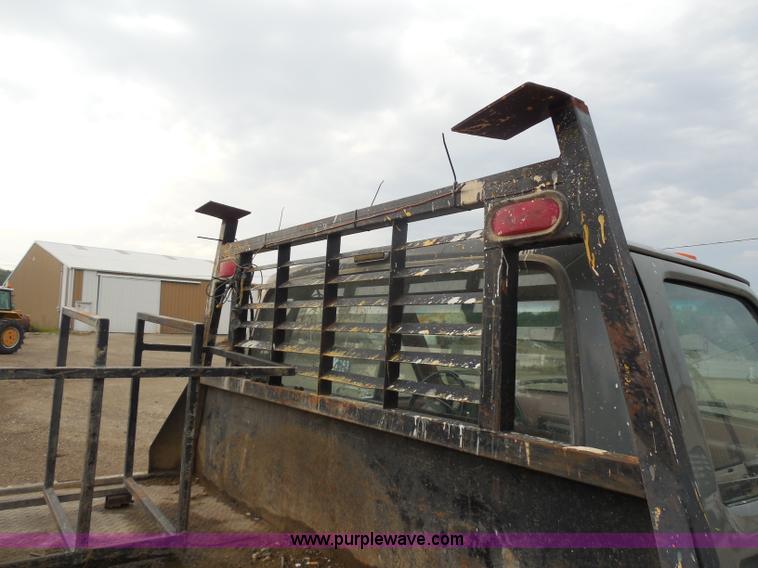 image for item H9854 1990 Ford F350 flatbed pickup truck