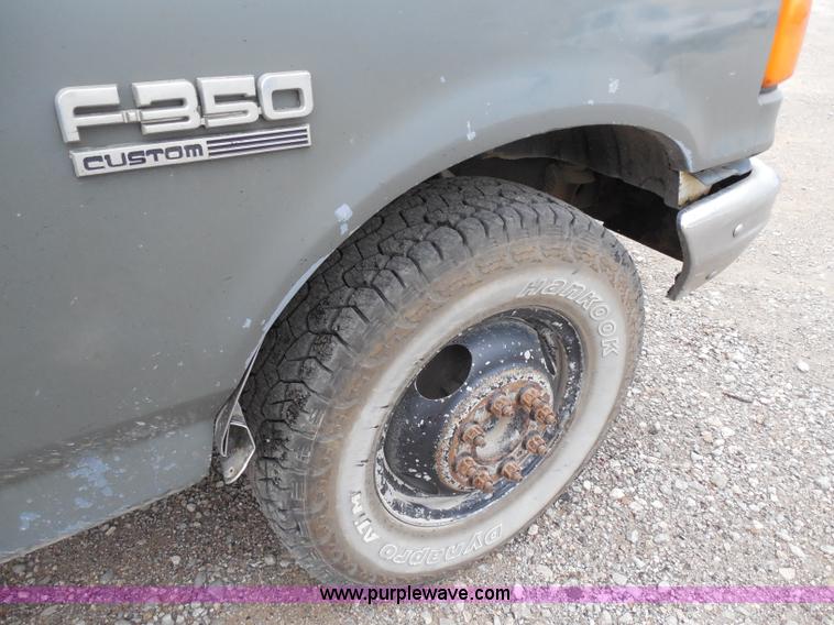 image for item H9854 1990 Ford F350 flatbed pickup truck