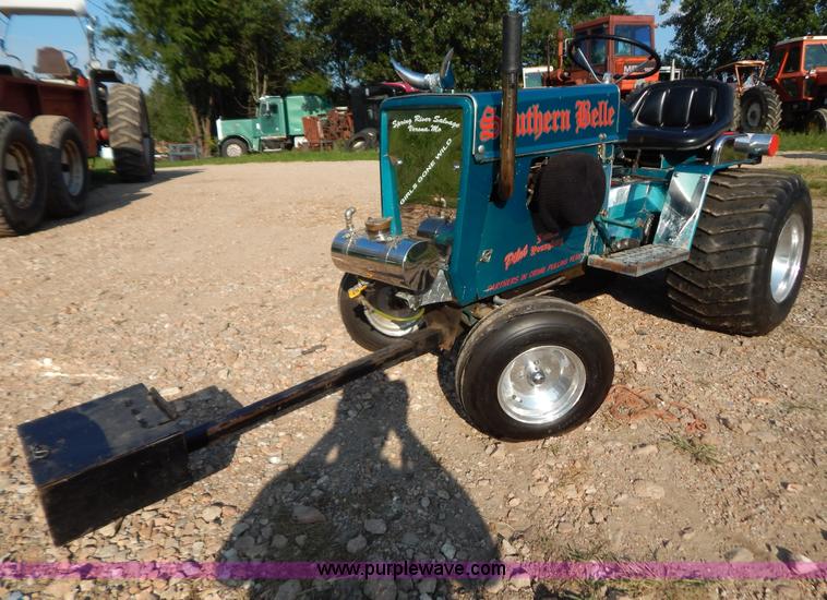 image for item AW9203 Cub Cadet pulling lawn tractor