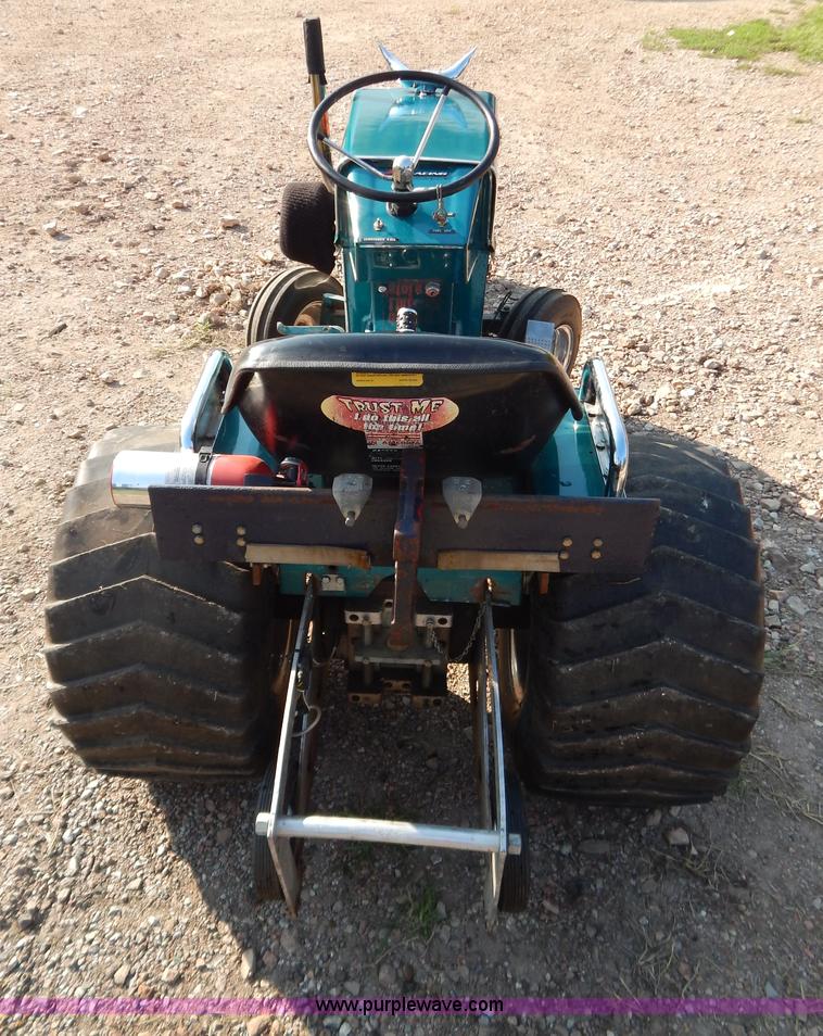 image for item AW9203 Cub Cadet pulling lawn tractor