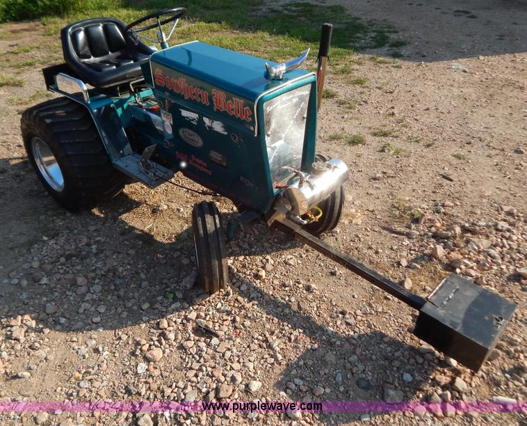 image for item AW9203 Cub Cadet pulling lawn tractor