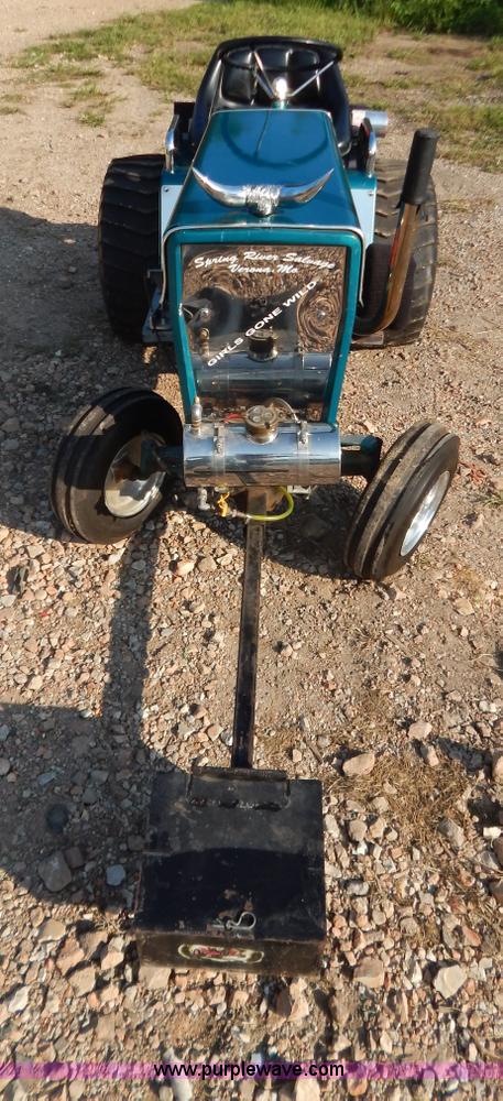 image for item AW9203 Cub Cadet pulling lawn tractor