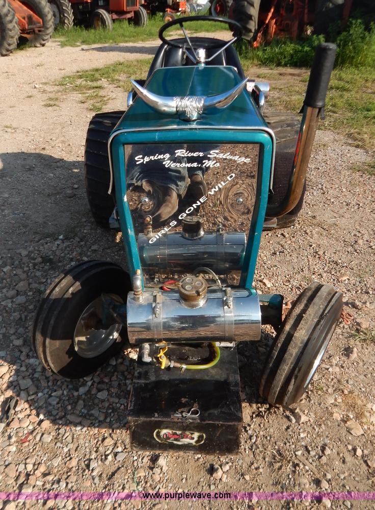 image for item AW9203 Cub Cadet pulling lawn tractor