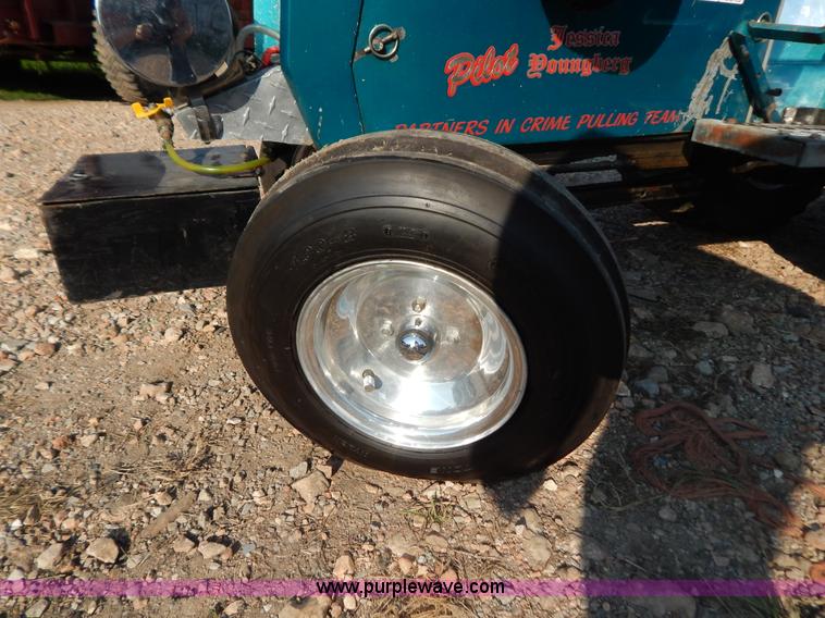 image for item AW9203 Cub Cadet pulling lawn tractor