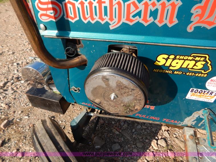 image for item AW9203 Cub Cadet pulling lawn tractor