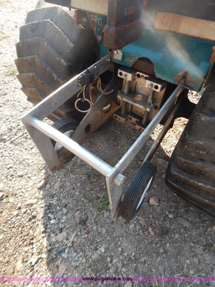 image for item AW9203 Cub Cadet pulling lawn tractor