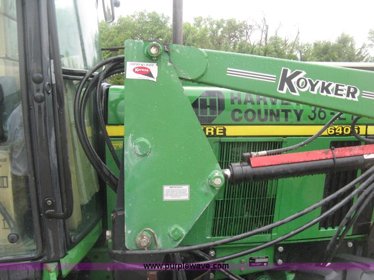 image for item D8490 2002 John Deere 6405 MFWD tractor