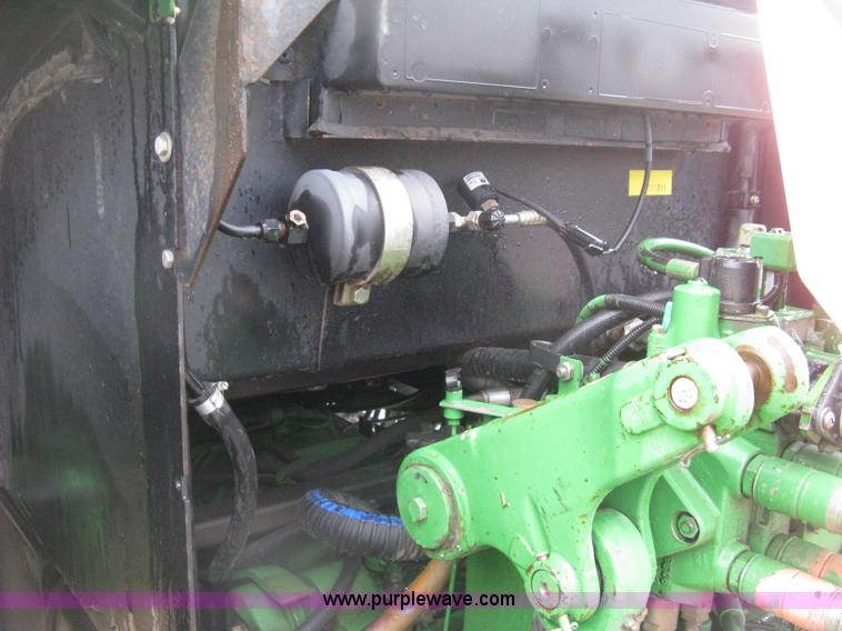 image for item D8490 2002 John Deere 6405 MFWD tractor