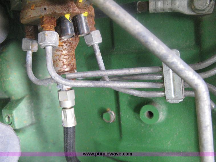 image for item D8490 2002 John Deere 6405 MFWD tractor