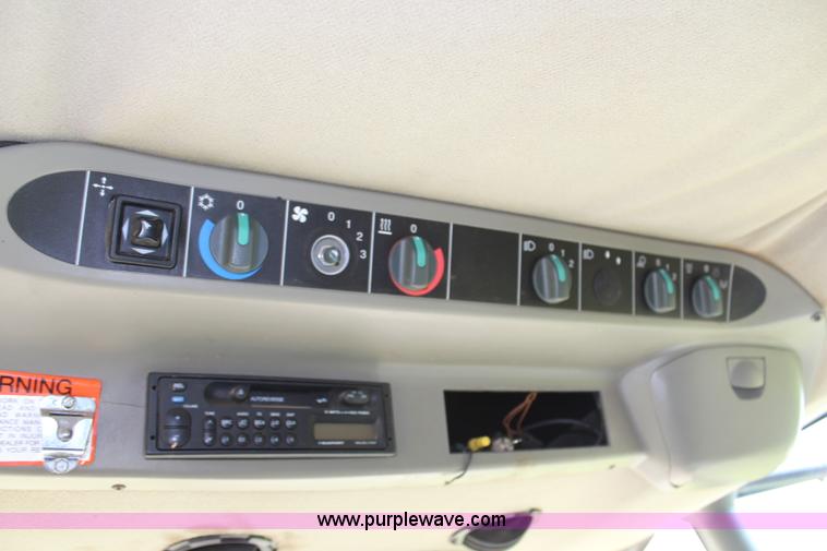 image for item H6539 1998 Caterpillar Lexion 460 RWA combine