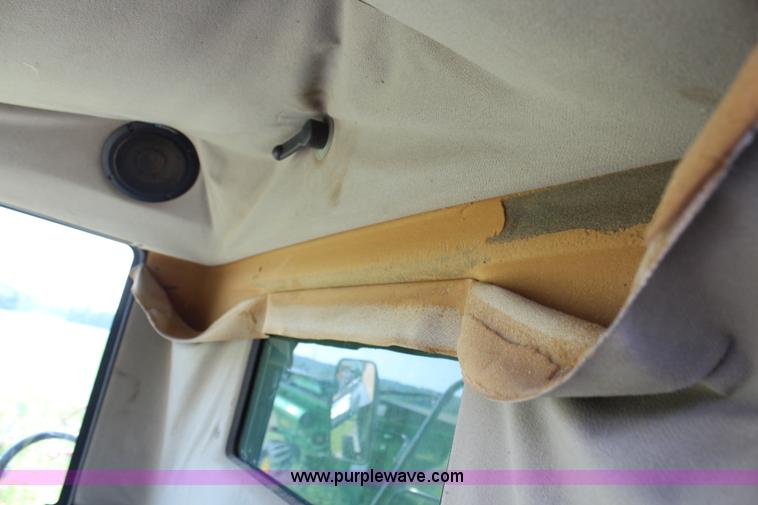 image for item H6539 1998 Caterpillar Lexion 460 RWA combine