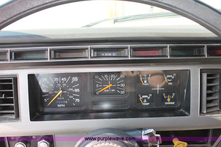 image for item I7948 1990 Ford F700 flatbed hauler truck