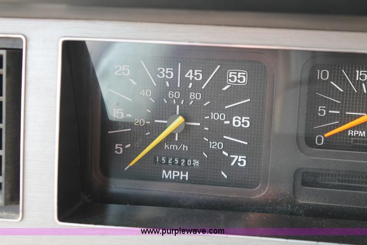 image for item I7948 1990 Ford F700 flatbed hauler truck