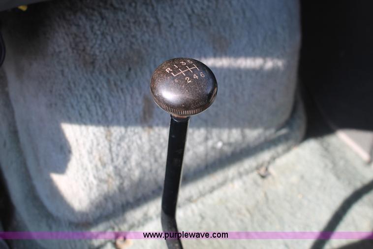 image for item I7948 1990 Ford F700 flatbed hauler truck