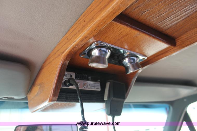 image for item I7948 1990 Ford F700 flatbed hauler truck