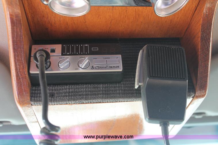 image for item I7948 1990 Ford F700 flatbed hauler truck