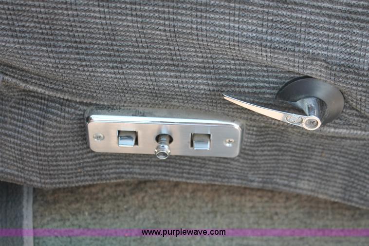 image for item I7948 1990 Ford F700 flatbed hauler truck