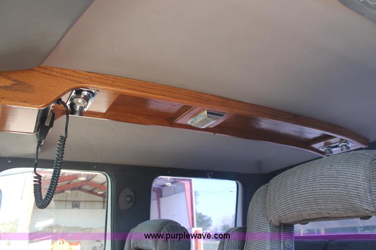 image for item I7948 1990 Ford F700 flatbed hauler truck