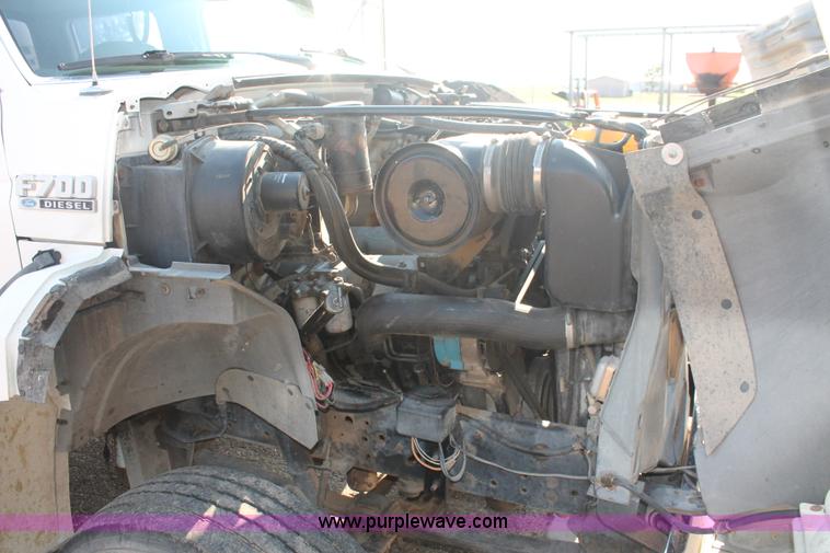 image for item I7948 1990 Ford F700 flatbed hauler truck