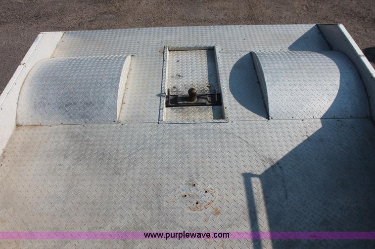 image for item I7948 1990 Ford F700 flatbed hauler truck