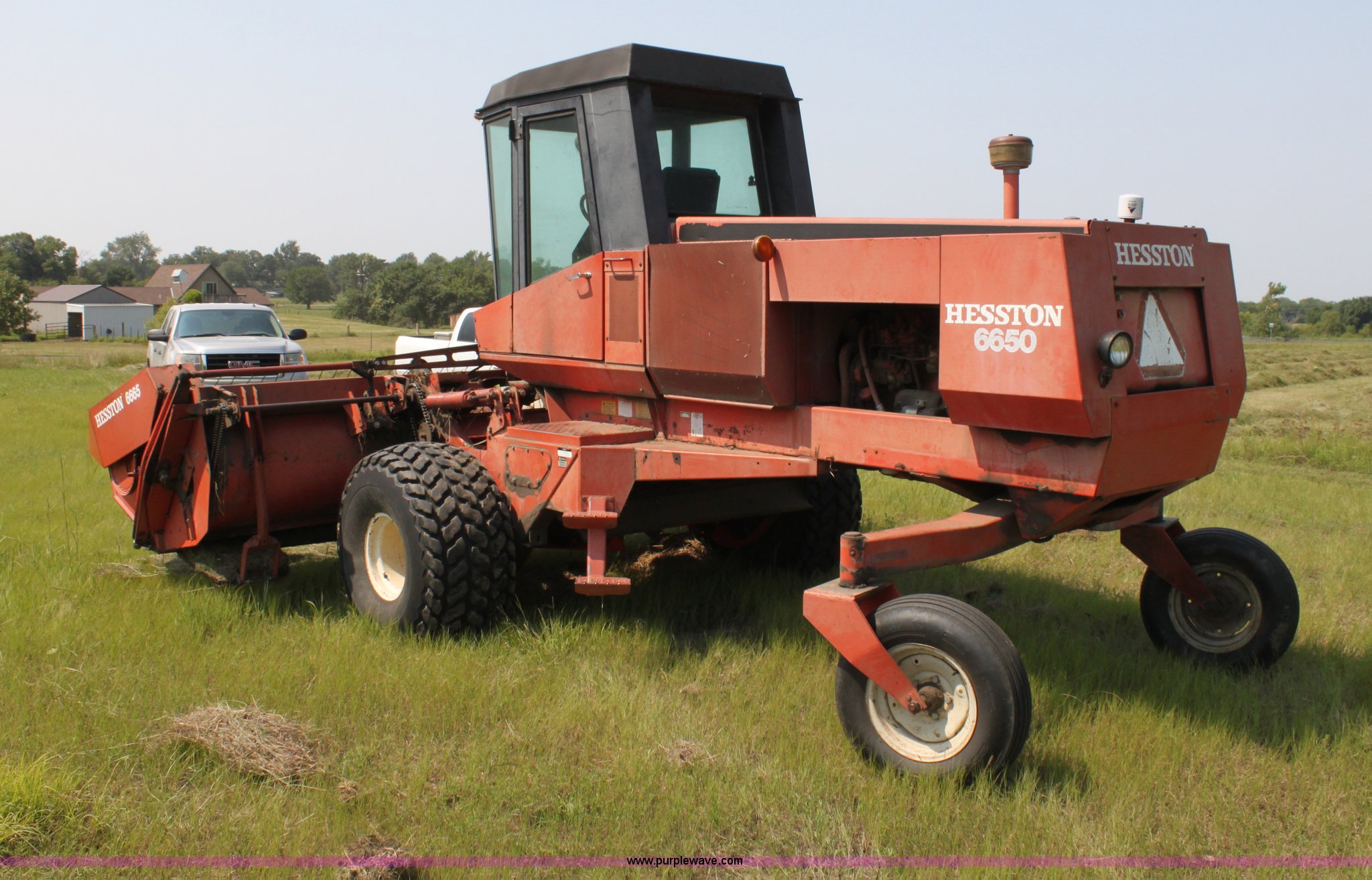Hesston 6650 selfpropelled swather in Emporia, KS Item G4110 sold