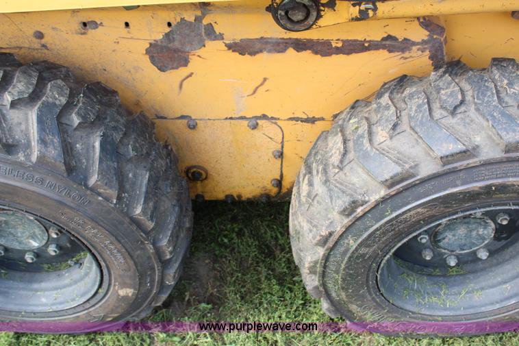 image for item H6519 1999 John Deere 250 skid steer