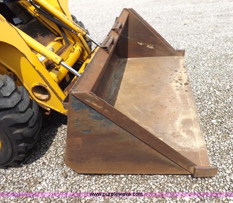 image for item I7651 2006 John Deere 320 skid steer