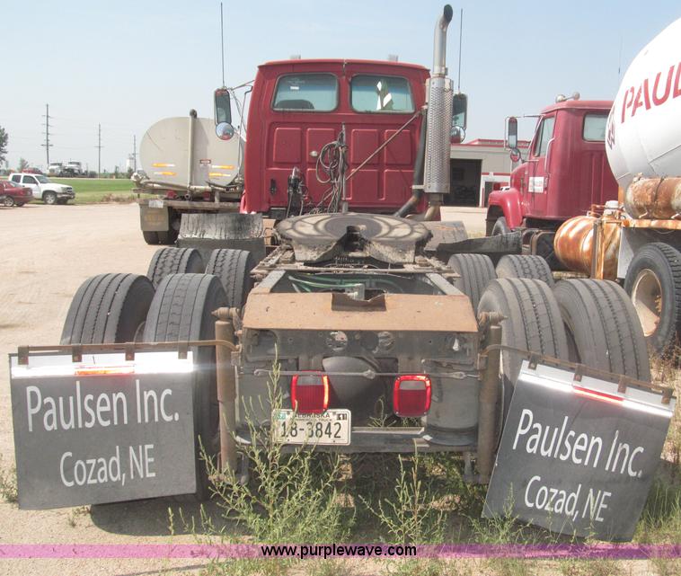 image for item F7088 1997 Ford LT9513 Louisville 113 triple axle semi truck