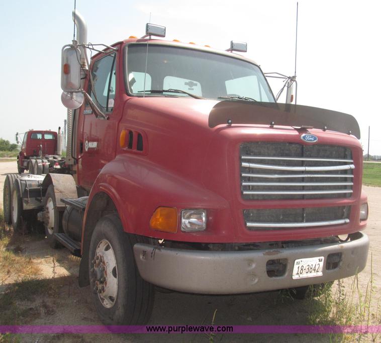 image for item F7088 1997 Ford LT9513 Louisville 113 triple axle semi truck